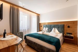 Postel nebo postele na pokoji v ubytování Hotel Andrea 3-Sterne Superior