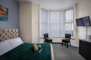 TV a/nebo společenská místnost v ubytování The Ocean Inn + 19 fotografií
