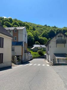 an empty street in a small town with houses at Studio Bareges Le Rioulet 1 in Barèges