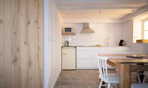 Η κουζίνα ή μικρή κουζίνα στο Apartamentos Boutique Murmur