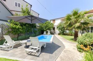 Der Swimmingpool an oder in der Nähe von Apartment Milena
