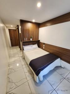 Voodi või voodid majutusasutuse Hotel Alambique Arandas toas
