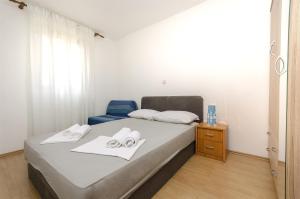 Ein Bett oder Betten in einem Zimmer der Unterkunft Apartment Milena
