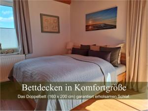 Ένα ή περισσότερα κρεβάτια σε δωμάτιο στο Wald und Waterkant