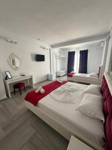 Postel nebo postele na pokoji v ubytování Cava Boutique Hotel