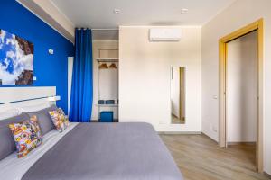 A bed or beds in a room at ARTrinacria Apartments - Qubba