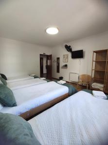 Cama ou camas em um quarto em Old Village Hostel