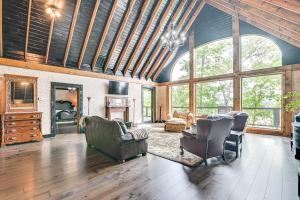 a living room with a couch and chairs at Upscale Getaway on Smith Lake with Boat Dock in Arley