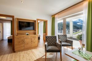 TV a/nebo společenská místnost v ubytování Hotel Andrea 3-Sterne Superior