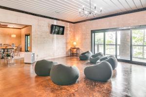a room with chairs sitting on the floor at Upscale Getaway on Smith Lake with Boat Dock in Arley