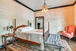 a bedroom with a bed and a chair at Upscale Getaway on Smith Lake with Boat Dock in Arley +35 photos