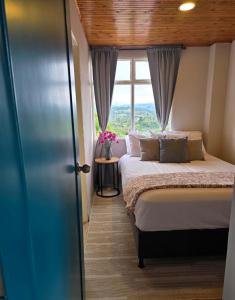 Кровать или кровати в номере Hotel Boutique Santa María