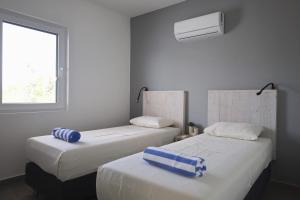 Letto o letti in una camera di Palm Crest