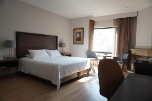 Katil atau katil-katil dalam bilik di Hotel Morrison Zona Rosa