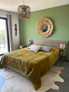 a bedroom with a large bed and a mirror at Villa H in Casanova +2 photos