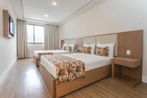 Кровать или кровати в номере Mirador Rio Copacabana Hotel