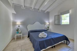 Postel nebo postele na pokoji v ubytování Villaggio Turistico Scialmarino + 37 fotografií