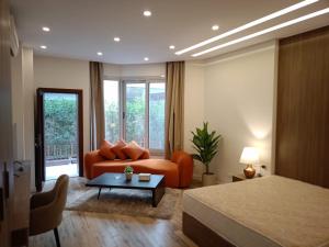 a bedroom with a bed and a couch and a table at Maison 7 Mirage Resort in Cairo +86 photos