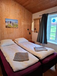 Ένα ή περισσότερα κρεβάτια σε δωμάτιο στο Lofoten Resort og rorbuer