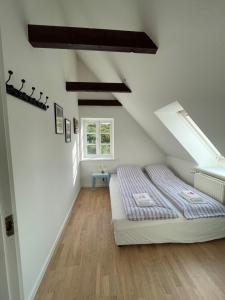 En eller flere senger på et rom på Slusehuset