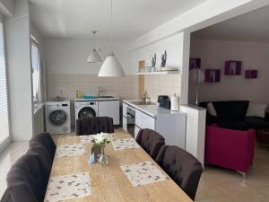 a kitchen and living room with a table and chairs at Penthouse at Cologne Cathedral in Cologne
