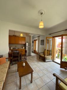 a living room with a couch and a table at Lula's House in Skiathos Town