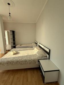 Letto o letti in una camera di Temo's guest house in Kvariati