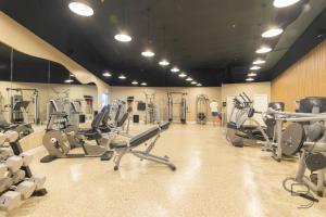 a gym with lots of cardio equipment in a room at Girasole Rentals in Miami Beach +22 photos