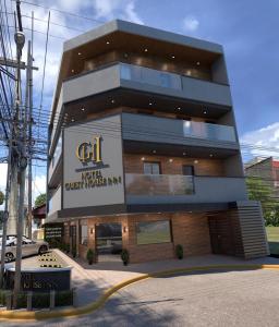 a building with a sign on the front of it at Hotel Guest House Inn in San Pedro Sula