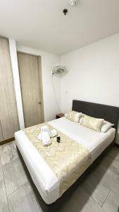 Posteľ alebo postele v izbe v ubytovaní Hotel Rosales Suite