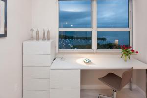 a white desk with a window in a room at MVR Suite Wellness Like You have Never Felt Before in Miami