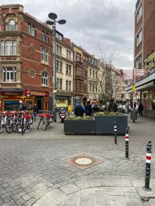 a city street with buildings and bikes parked on the street at Apartment 8 at Cologne Cathedral in Cologne
