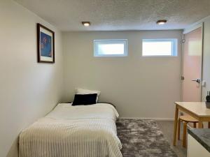 a small bedroom with a bed in the corner at Studio with private entrance in Seinäjoki