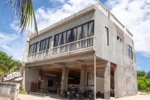 a building with motorcycles parked in front of it at Ohayo Siargao in General Luna