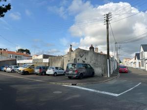 a group of cars parked in a parking lot at CHAMBRE COCOONING centre ville des Sables D'Olonne quartier Gare Saint Michel située à 1 kilomètre du remblai in Les Sables-d'Olonne