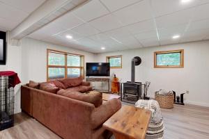 a living room with a couch and a fireplace at Green Mountain Escape in Wilmington