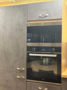 a microwave oven sitting inside of a kitchen at Les Halles in Chaumont