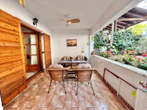 a patio with chairs and a table on a porch at Tradiotional house in Metamorfosi