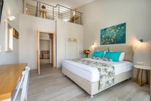 a bedroom with a large bed in a room at ALDEBARAN HOMES in Limenaria +174 photos