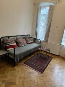 a bedroom with a bed with pillows and a table at Abanotubani apartment in Tbilisi City