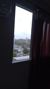 a window in a room with a view of a city at Casita de Tucuman in San Miguel de Tucumán