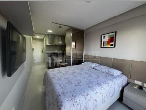 Giường trong phòng chung tại HOLANDAS PRIME RESIDENCE - perto de TUDO