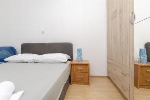 Ein Bett oder Betten in einem Zimmer der Unterkunft Apartment Milena