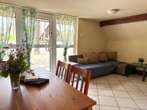 a living room with a table and a couch at Jak Tu Sielsko in Osiek +67 photos