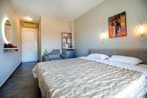 Postel nebo postele na pokoji v ubytování Aldebaran Hotel Apartments