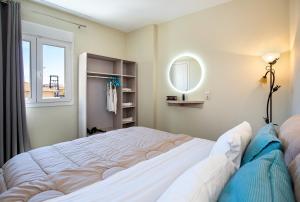 Postel nebo postele na pokoji v ubytování Aldebaran Hotel Apartments