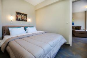 Postel nebo postele na pokoji v ubytování Aldebaran Hotel Apartments