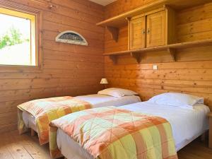 Ένα ή περισσότερα κρεβάτια σε δωμάτιο στο Borselier vue Montagne, Spa & Terrasse