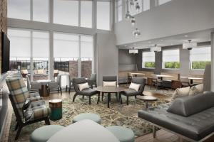 a rendering of a lobby with tables and chairs at Residence Inn by Marriott San Antonio SeaWorld /Westover Hills in San Antonio