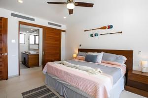 a bedroom with a large bed and a bathroom at Alamar Vallarta vta in Cruz de Huanacaxtle +96 photos